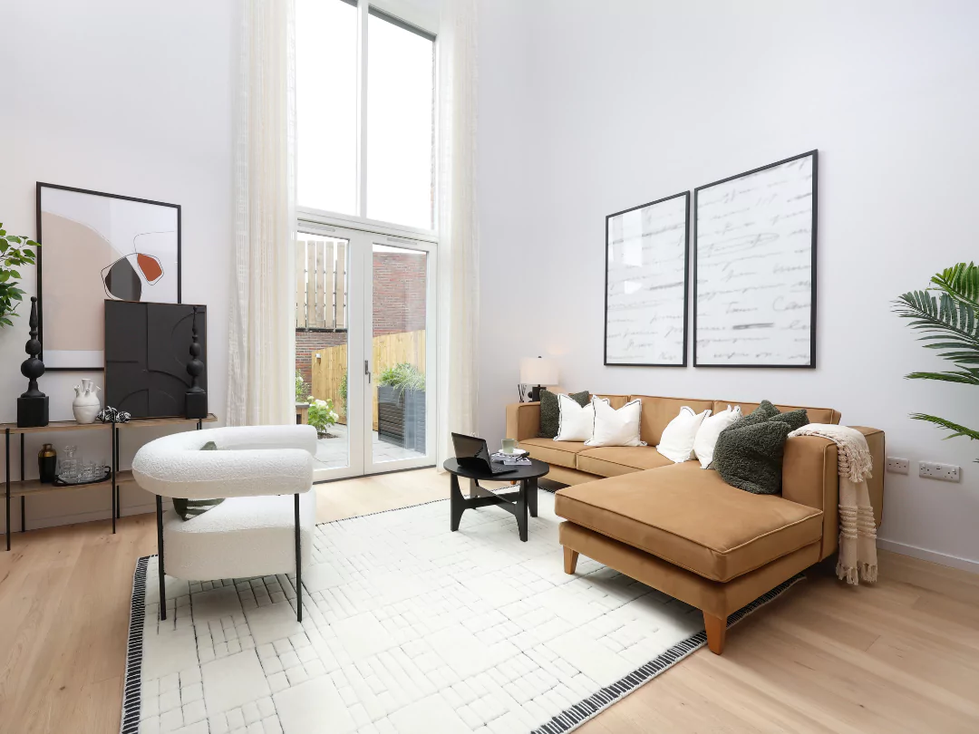 Styled double height living space with ample natural light flooding in from the patio doors.