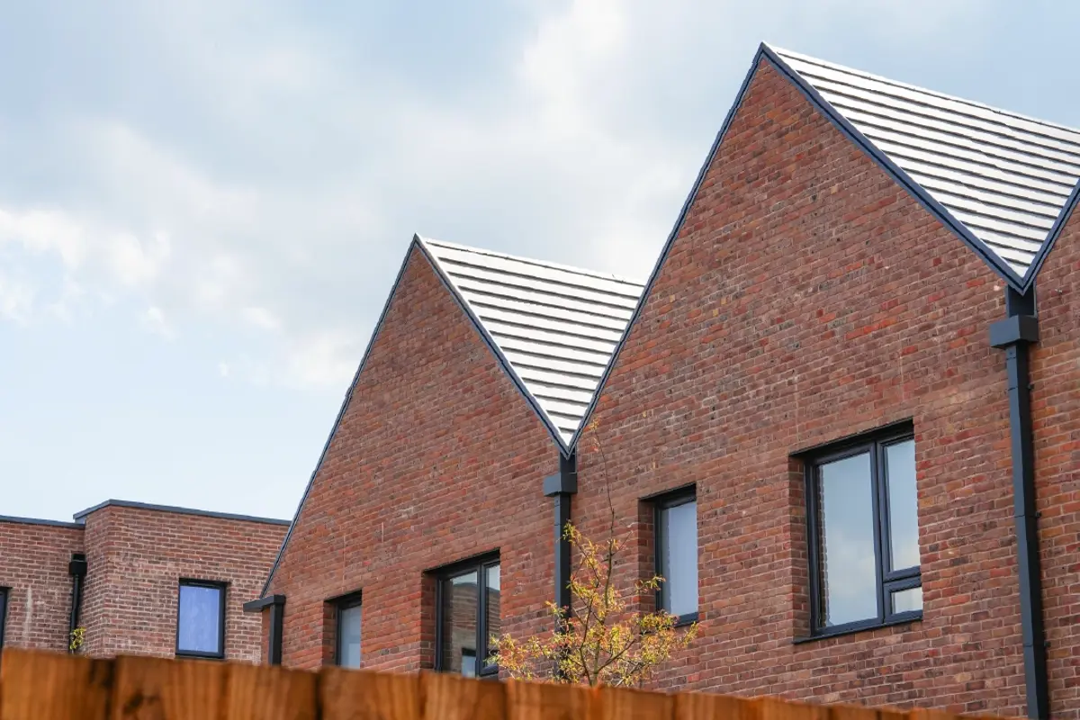 Modern brick terrace house, with A-frame roofline at Brabazon, Bristol.
