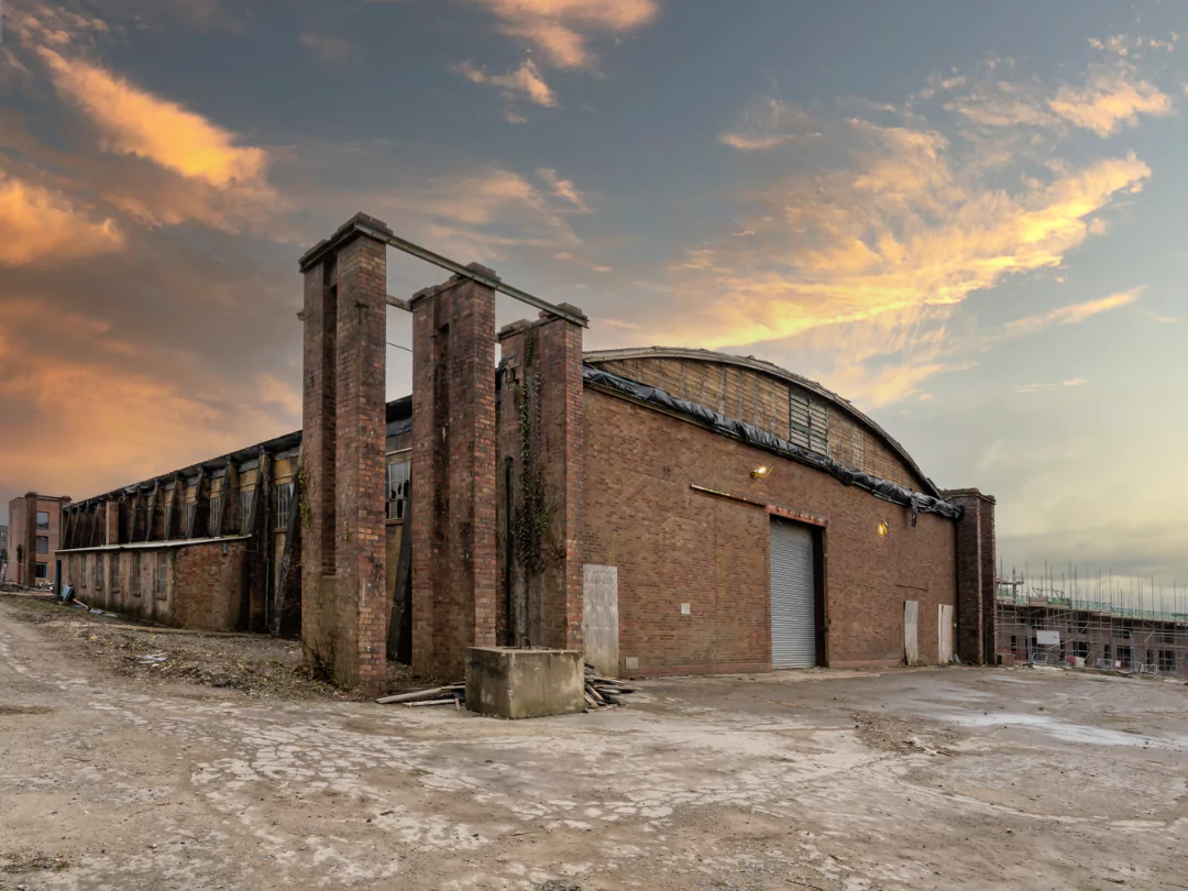 Wide angle shot of a historic brick aircraft hangar at Dusk on the former Filton Airfield. 