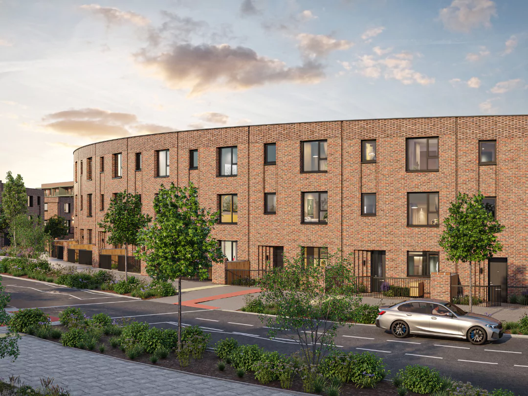 A row of three-storey Braemar townhomes on a curved tree-lined crescent at Brabazon.